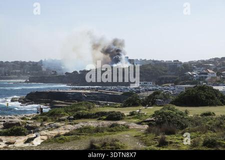 Sydney, Australia - 17 February 2018: Bushfire with dark smoke at Dunningham Reserve between Coogee Beach and Gordon's Bay Stock Photo