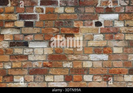 Multicolor red, white and black multicolor old vintage brick wall texture as background Stock Photo