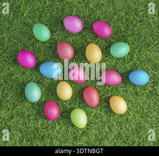 Multicolored easter eggs on the green grass Stock Photo