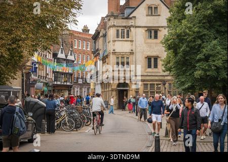 Tourists walk along Trinity Street.  Cambridge University, UK. Stock Photo
