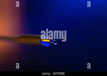 Macro type c connector in neon light. Usb c plug. Stock Photo