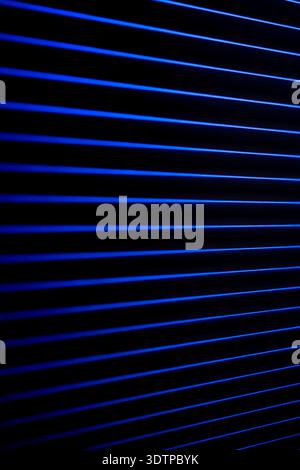 Vertical neon pattern of blue lines. Dark background. Stock Photo