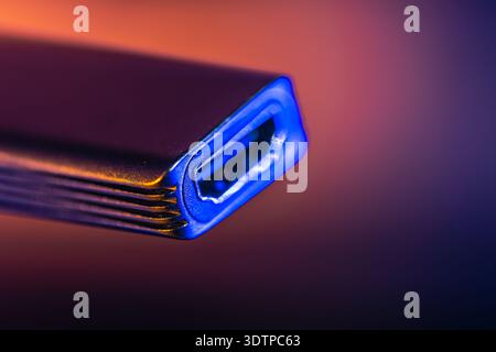 Macro usb type c port in neon light. Connector closeup. Stock Photo