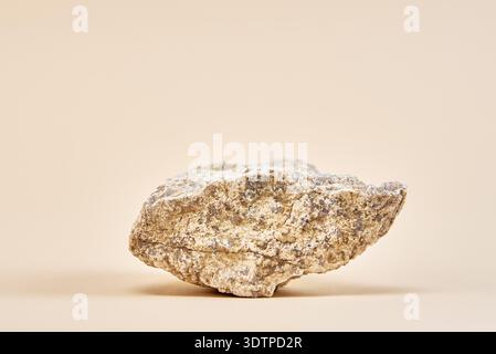 Natural granit stone on beige background, minimal product podium Stock Photo