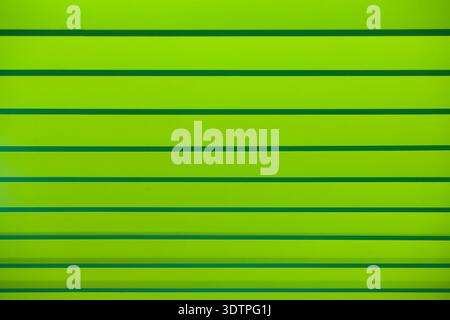 Green striped abstract background. Geometric color gradient. Minimal composition Stock Photo