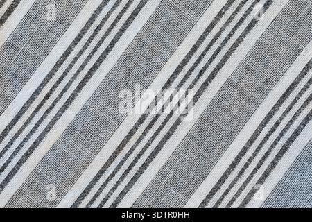 Striped material pattern white and grey diagonal lines. Cotton fabric close up Stock Photo