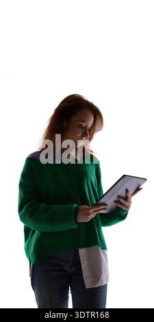 Young woman using tablet isolated on white background. Stock Photo