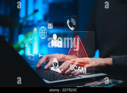 Scam Alert Warning with Cybersecurity Icons. A person using laptop, warning sign for scams with icons representing online threats, phishing, Stock Photo
