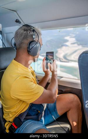 aerial-view-from-a-passenger-airplane-window-during-sunset-the-moon-is