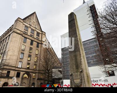 Manchester, UK - January 29, 2026: A historic sandstone Manchester Town Hall Extension building sits beside a tall Cenotaph scaffolded structure under Stock Photo