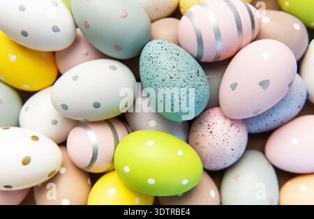 Decorative easter eggs displaying various pastel colors, patterns, and speckles for spring celebration Stock Photo