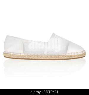 White womans mesh slip on espadrille flat shoes Stock Photo