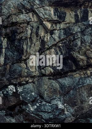 An Intricate Display of Natural Rock Formations Featuring Diverse Textures and Patterns in Shades of Gray and Brown Stock Photo