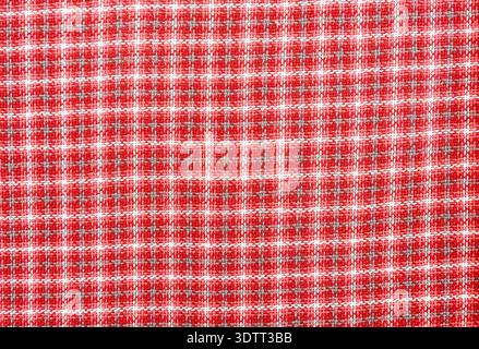Woven wool fabric as a creative backdrop. Wool fabric texture. Threads texture as background in red Stock Photo