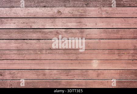 Old rough wooden boards with cracks as creative background in brown color. Wooden planks texture with the shabby paint Stock Photo