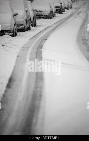 Parked cars covered in snow after heavy snowfall Stock Photo