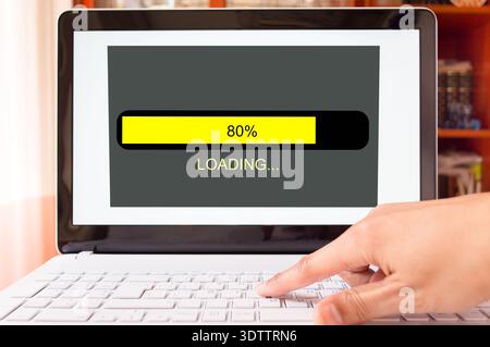 detail of man pushing and loading of the laptop at home Stock Photo