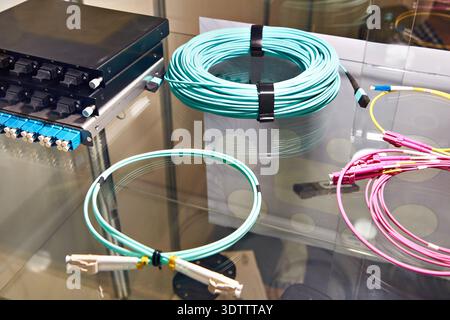 Fiber optic cables with connectors on the switch Stock Photo