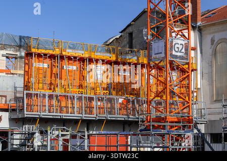 Nancy, France - View on a building under construction with Sateco orange formwork, and several walls under construction. Stock Photo