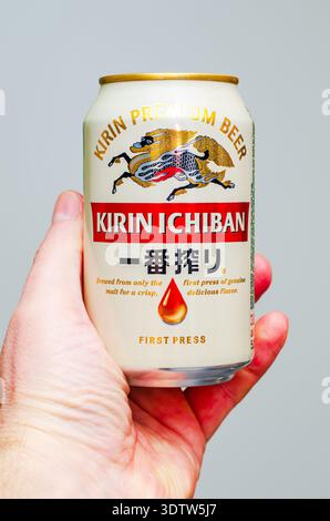 ISERLOHN, GERMANY — FEBRUARY 23, 2026: can of Kirin Ichiban premium beer held in hand against neutral background Stock Photo