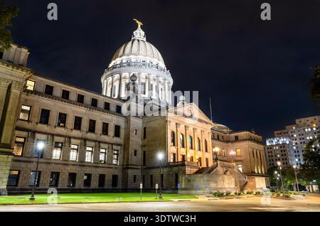 Mississippi State Capitol building stands in Jackson, USA. Historic Beaux-Arts architecture features the illuminated dome and stone columns under a dark night sky Stock Photo