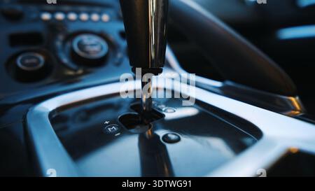 Modern Automatic Transmission Shifter In Contemporary Car Interior Against Car Dashboard Control Panel Stock Photo