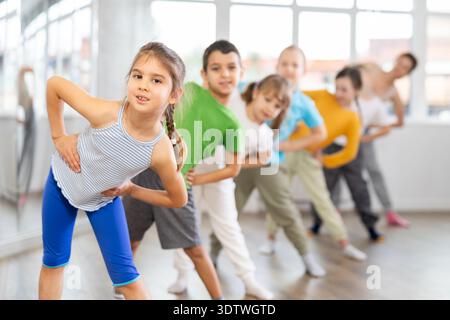 Group of children warming up before dance class Stock Photo