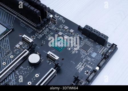 Motherboard chipset without heatsink, detailed semiconductor component on modern computer hardware platform close up Stock Photo