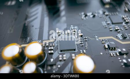 Macro shot of central processor chip on printed circuit board with capacitors, modern computer hardware and semiconductor engineering concept Stock Photo