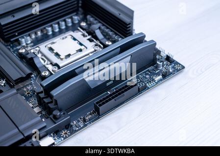 Installed ddr5 memory modules on motherboard, modern computer hardware platform for high speed gaming and workstation computing systems Stock Photo