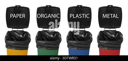 Garbage cans in different colors for waste separation isolated on white. Each for different types of trash (paper, plastic, organic and metal) Stock Photo