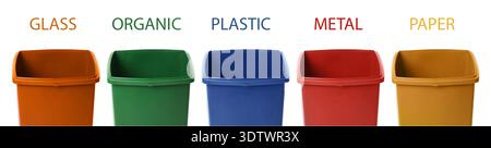 Garbage cans in different colors for waste separation isolated on white. Each for different types of trash (paper, plastic, glass, organic and metal) Stock Photo