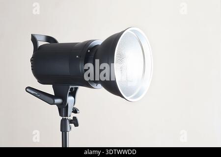 Modern studio strobe fitted with a light modifier, delivering soft yet directional illumination ideal for portrait, fashion and product photography Stock Photo