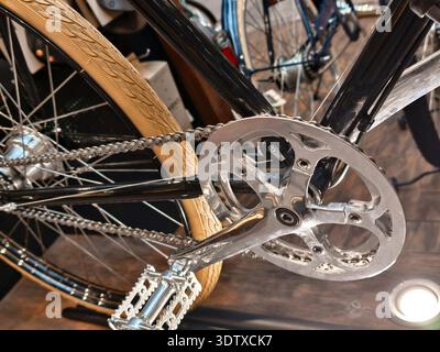 Bicycle close-up showcasing intricate details and craftsmanship in a modern shop during daylight hours Stock Photo