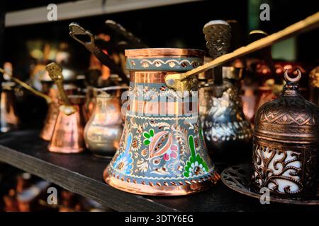Traditional Copper Coffee Pots Displayed on Market Shelf Stock Photo