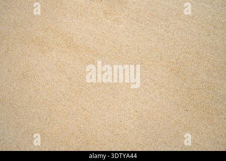 Close-up of fine golden sand on a beach along the Atlantic coast. A subtle natural background. Stock Photo