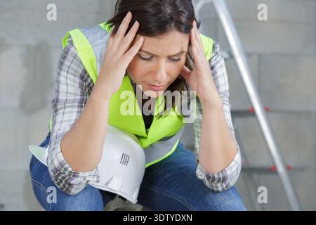 beautiful worker woman feeling fatigue and headache Stock Photo