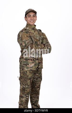Soldier in military camouflage uniform standing in studio Stock Photo