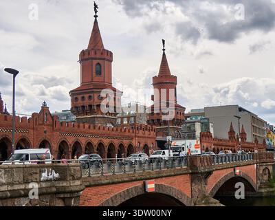 Berlin Oberbaum Bridge with Yellow U-Bahn Train over Spree River Stock Photo
