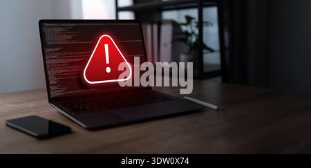 Cybersecurity warning alert concept showing system risk and code Cyber attack interface on laptop for digital security Virus, Spyware and IT protectio Stock Photo