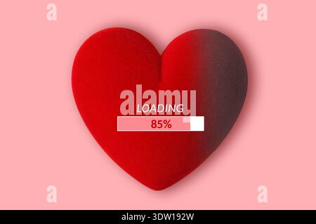 Heart with loading progress bar on pink background - Concept of love and time Stock Photo