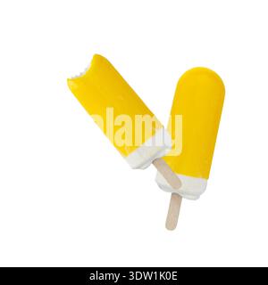 Two tasty yellow ice cream, whole and bitten popsicle flying isolated on white background. Lemon or pineapple or mango fruits cold summer dessert. Stock Photo