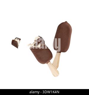 Chocolate covered ice cream bar on stick with condensation, whole and bitten flying on white background. Chocolate sweet popsicle or pop is frozen Stock Photo