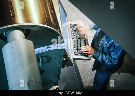 Starbucks's stuff works on the compuer in a famous Starbucks in Chicago. Stock Photo