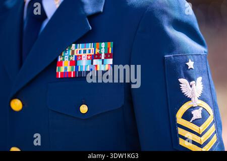 Military uniform with decorated service ribbons. Formal uniform showing rank insignia. Ceremonial uniform symbolizing authority. Professional uniform Stock Photo