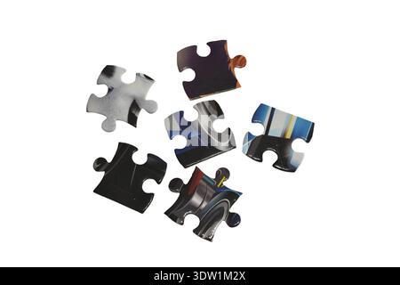 Individual puzzles are randomly isolated on a white background. Stock Photo