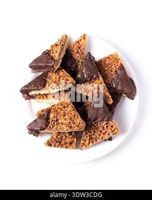 Top view walnut and coconut corners cookies dipped in white chocolate Stock Photo