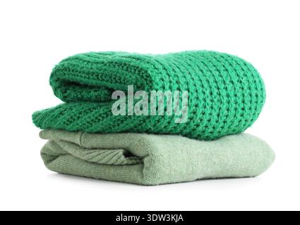 Stack of clean sweaters isolated on white background Stock Photo