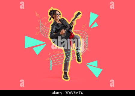 Stylish young African-American woman in leather jacket playing acoustic guitar on red background Stock Photo