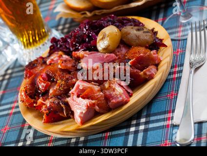 Juicy baked in beer pork knuckle Stock Photo